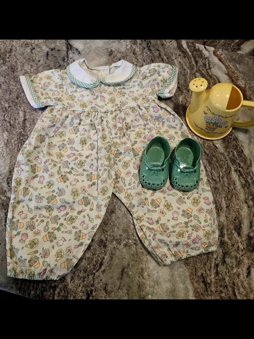 The Gardening Set is a Bitty Baby outfit released in 1996 and later retired.